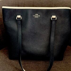 Coach purse. Navy with white trim. In great condition.